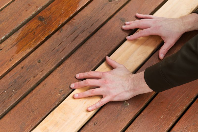 Handyman fixing deck boards